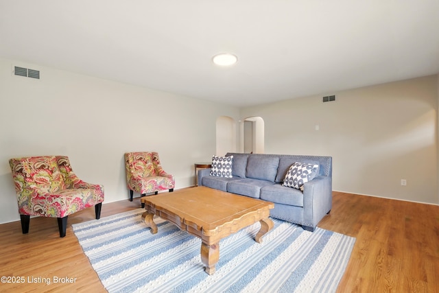 1212 Hibiscus Dr, Clarksville, IN 47129 - living room with light wood-style flooring and arched walkways