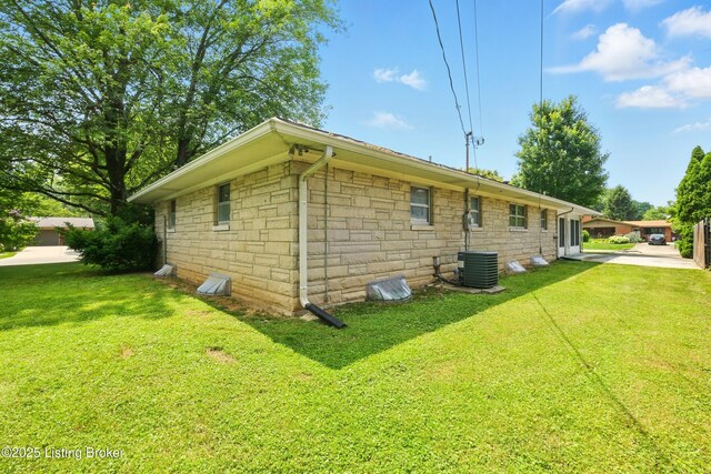 1212 Hibiscus Dr, Clarksville, IN 47129 - view of property exterior with stone siding and a yard