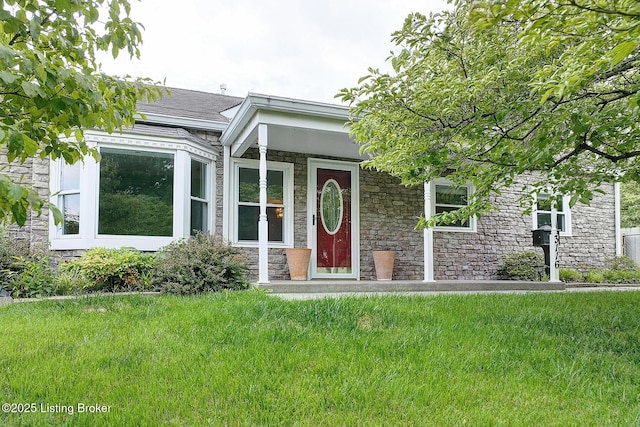 3116 Osprey Rd, Louisville, KY 40213 - view of front facade featuring stone siding and a front lawn