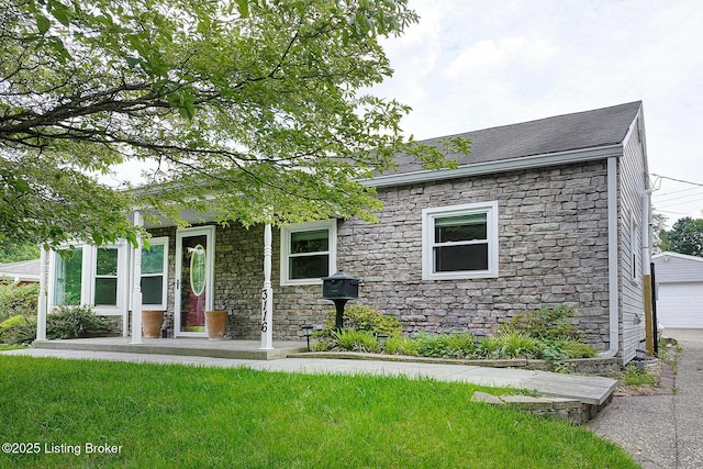 3116 Osprey Rd, Louisville, KY 40213 - view of front of home with stone siding, a garage, and roof with shingles