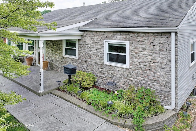 3116 Osprey Rd, Louisville, KY 40213 - view of side of property with roof with shingles and stone siding