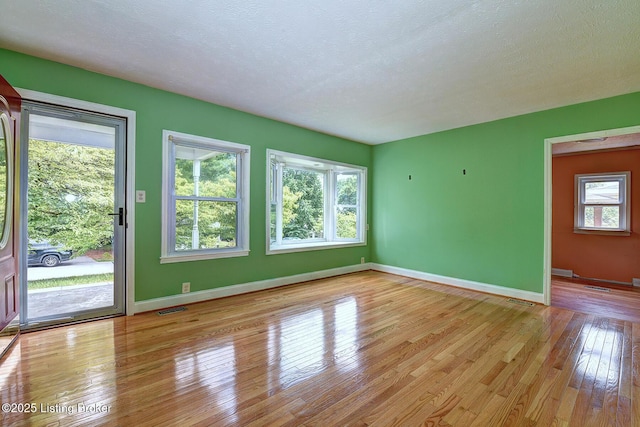 3116 Osprey Rd, Louisville, KY 40213 - spare room with hardwood / wood-style floors and a textured ceiling