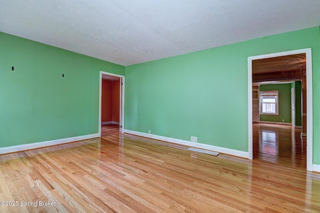 3116 Osprey Rd, Louisville, KY 40213 - empty room featuring light wood-style floors and a textured ceiling