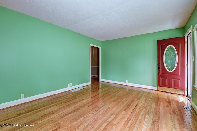3116 Osprey Rd, Louisville, KY 40213 - empty room with wood finished floors and a textured ceiling