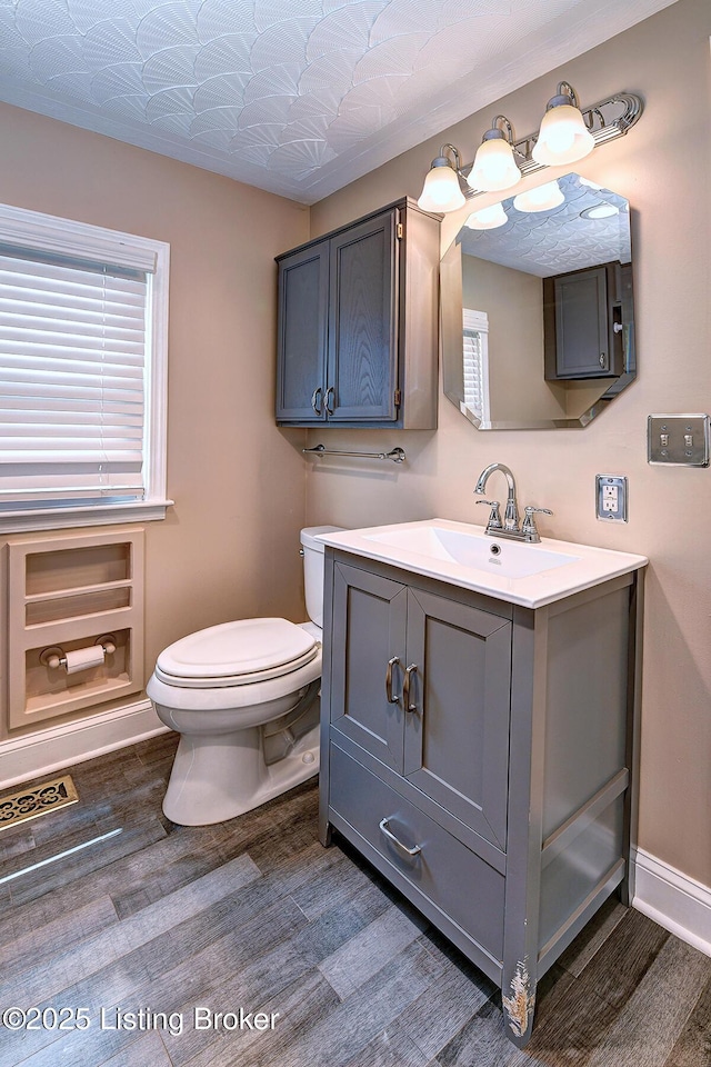 3116 Osprey Rd, Louisville, KY 40213 - half bath featuring vanity and wood finished floors