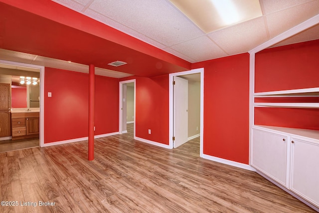 3116 Osprey Rd, Louisville, KY 40213 - empty room with wood finished floors and a paneled ceiling