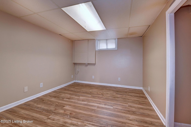 3116 Osprey Rd, Louisville, KY 40213 - below grade area featuring a drop ceiling and light wood-style floors