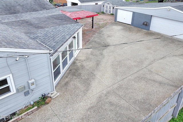 3116 Osprey Rd, Louisville, KY 40213 - exterior view of roof with shingles, gutters, and a downspout
