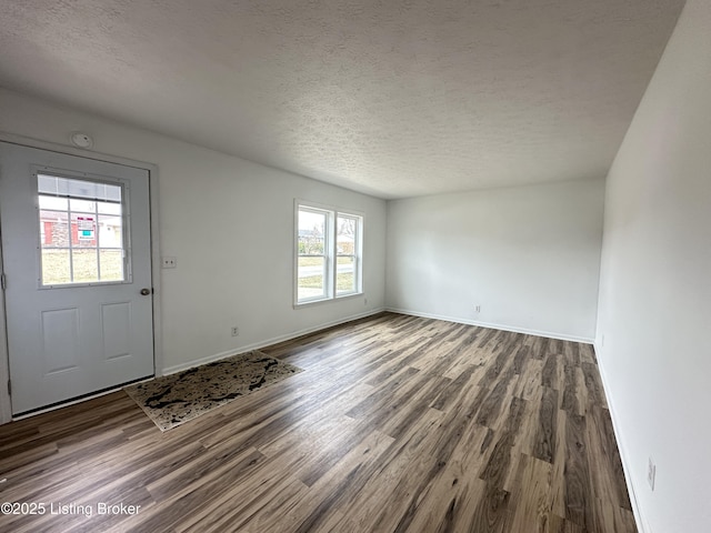 62 Jefferson Ave, Bardstown, KY 40004 - foyer entrance with wood finished floors, baseboards, and a textured ceiling