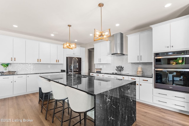 6299 Clore Ln, Crestwood, KY 40014 - kitchen featuring wall chimney exhaust hood, a chandelier, double oven, light wood-type flooring, and recessed lighting