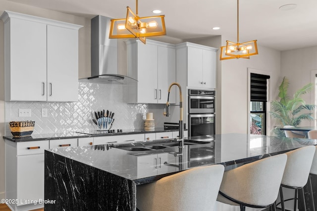 6299 Clore Ln, Crestwood, KY 40014 - kitchen with wall chimney exhaust hood, a chandelier, black electric stovetop, stainless steel double oven, and backsplash