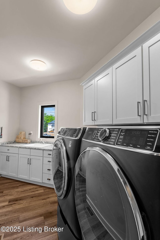 6299 Clore Ln, Crestwood, KY 40014 - laundry room with cabinet space, separate washer and dryer, and wood finished floors