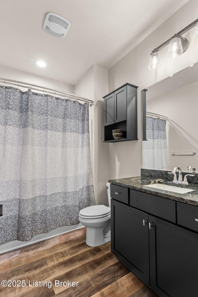 6299 Clore Ln, Crestwood, KY 40014 - bathroom featuring toilet, vanity, and wood finished floors