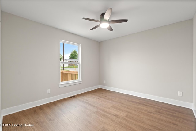 115 Crutcher St, Vine Grove, KY 40175 - spare room with wood finished floors, a ceiling fan, and baseboards