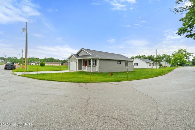 115 Crutcher St, Vine Grove, KY 40175 - view of home's exterior with a yard, a garage, and driveway