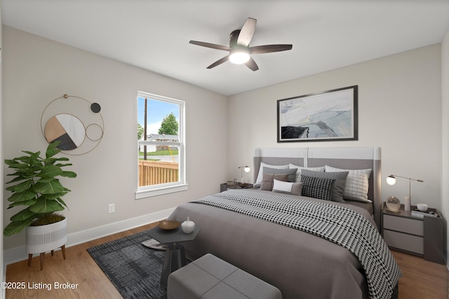115 Crutcher St, Vine Grove, KY 40175 - bedroom with wood finished floors, baseboards, and a ceiling fan