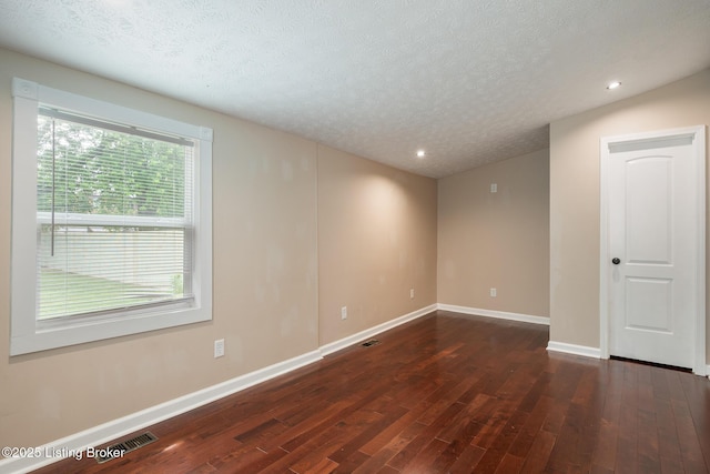 948 Samuel St, Louisville, KY 40204 - unfurnished room featuring dark wood-style flooring, a textured ceiling, and recessed lighting