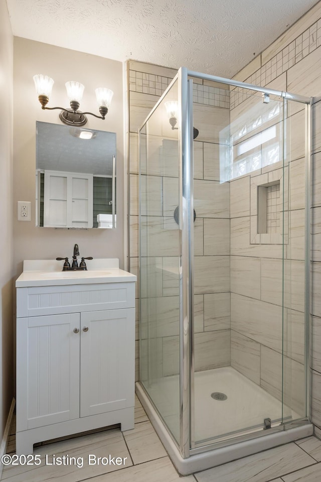 948 Samuel St, Louisville, KY 40204 - full bathroom featuring vanity, a shower stall, and a textured ceiling