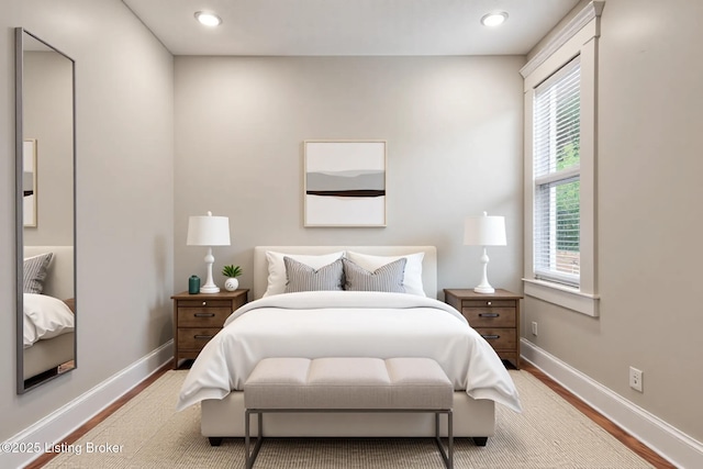 948 Samuel St, Louisville, KY 40204 - bedroom with wood finished floors, multiple windows, and recessed lighting