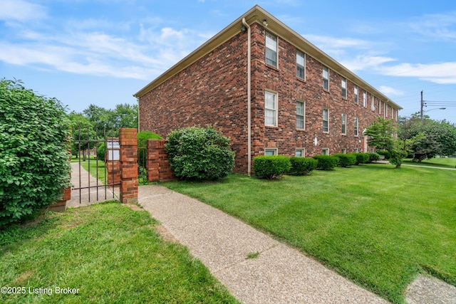 1007 Lake Pl Unit H11, Louisville, KY 40222 - view of side of property featuring a yard and brick siding
