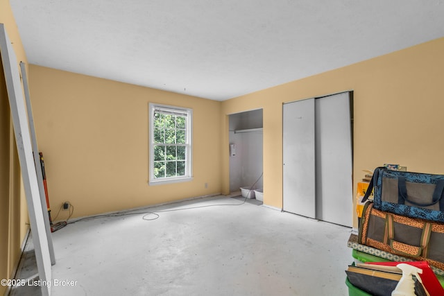 1007 Lake Pl Unit H11, Louisville, KY 40222 - unfurnished bedroom with multiple closets and unfinished concrete floors