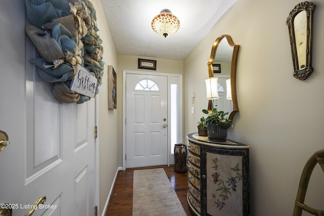 12582 Springfalls Ct, Louisville, KY 40229 - doorway with dark wood-style floors and baseboards