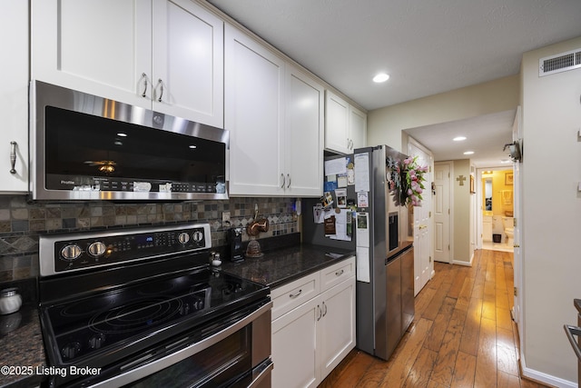 12582 Springfalls Ct, Louisville, KY 40229 - kitchen featuring stainless steel appliances, white cabinets, backsplash, and recessed lighting