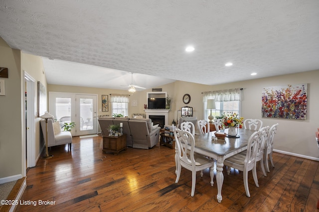12582 Springfalls Ct, Louisville, KY 40229 - dining area with hardwood / wood-style floors, a fireplace, recessed lighting, ceiling fan, and a textured ceiling