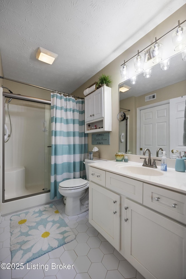 12582 Springfalls Ct, Louisville, KY 40229 - full bathroom with a stall shower, vanity, tile patterned floors, and a textured ceiling