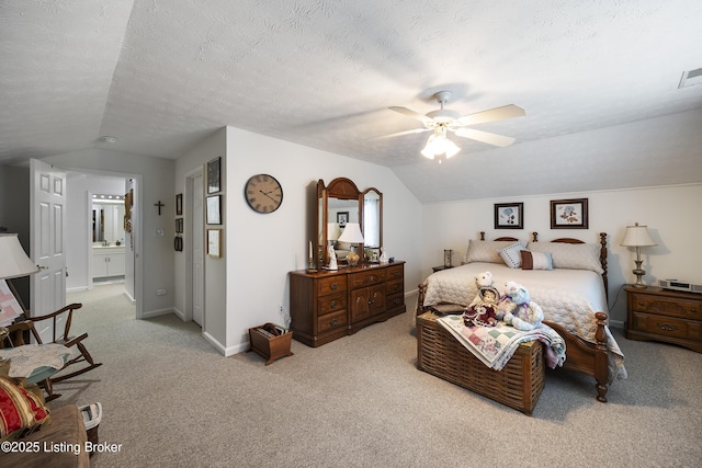 12582 Springfalls Ct, Louisville, KY 40229 - carpeted bedroom featuring vaulted ceiling, ensuite bathroom, and ceiling fan