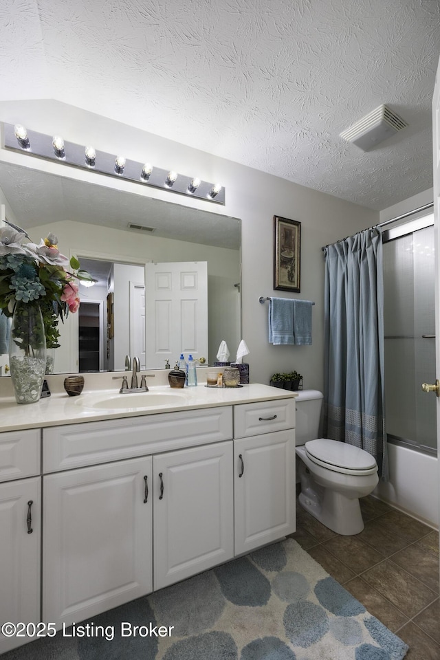 12582 Springfalls Ct, Louisville, KY 40229 - full bathroom with vanity, shower / tub combo, tile patterned flooring, and a textured ceiling