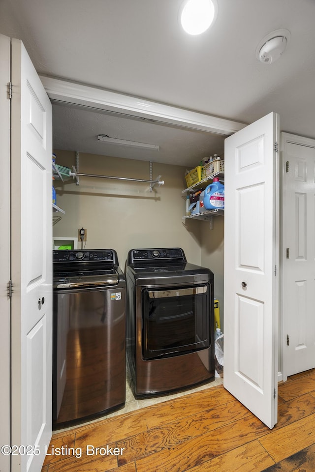 12582 Springfalls Ct, Louisville, KY 40229 - washroom featuring independent washer and dryer and wood finished floors