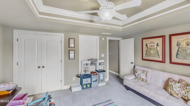 8705 Summit Ridge Dr, Louisville, KY 40241 - carpeted living area with a raised ceiling, ceiling fan, ornamental molding, and baseboards