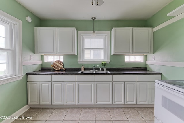 3019 Wirth Ave, Louisville, KY 40217 - kitchen featuring electric stove, white cabinetry, and light tile patterned flooring