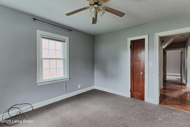 3019 Wirth Ave, Louisville, KY 40217 - unfurnished bedroom with dark colored carpet and ceiling fan