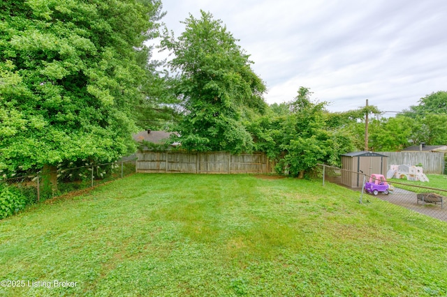 3019 Wirth Ave, Louisville, KY 40217 - fenced backyard featuring a storage unit