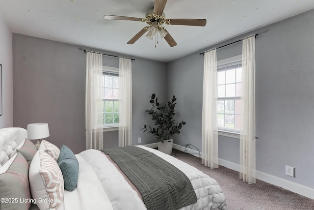 3019 Wirth Ave, Louisville, KY 40217 - carpeted bedroom featuring multiple windows and ceiling fan