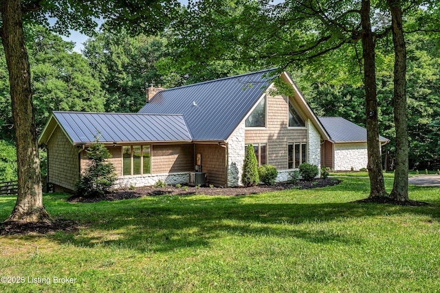 2918 Spickert Knob Rd, Floyds Knobs, IN 47119 - view of front facade featuring a front yard, a metal roof, a chimney, and a standing seam roof