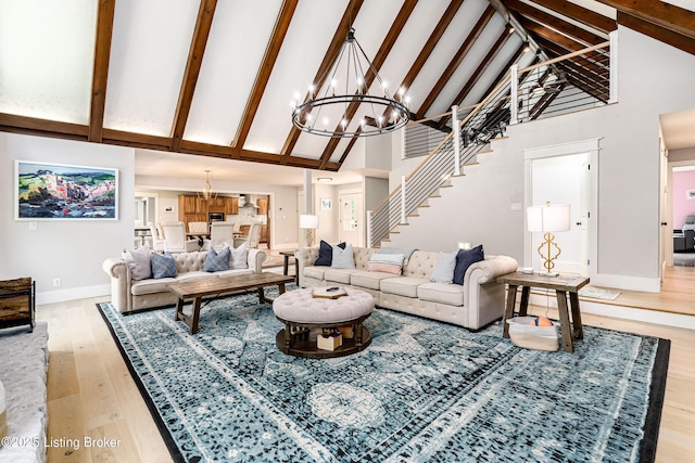 2918 Spickert Knob Rd, Floyds Knobs, IN 47119 - living area with a chandelier, high vaulted ceiling, light wood-type flooring, stairs, and beamed ceiling