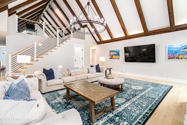 2918 Spickert Knob Rd, Floyds Knobs, IN 47119 - living room featuring high vaulted ceiling, stairway, wood finished floors, beam ceiling, and a chandelier