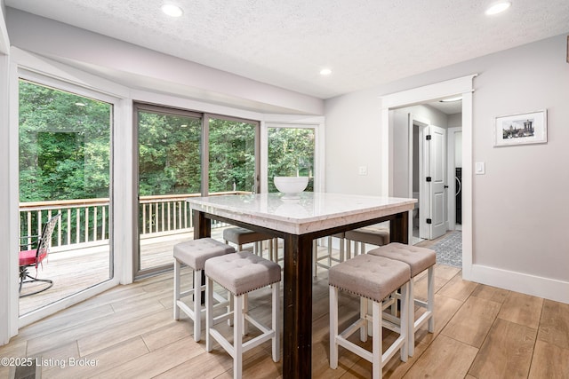 2918 Spickert Knob Rd, Floyds Knobs, IN 47119 - dining room featuring light wood finished floors, a textured ceiling, and recessed lighting