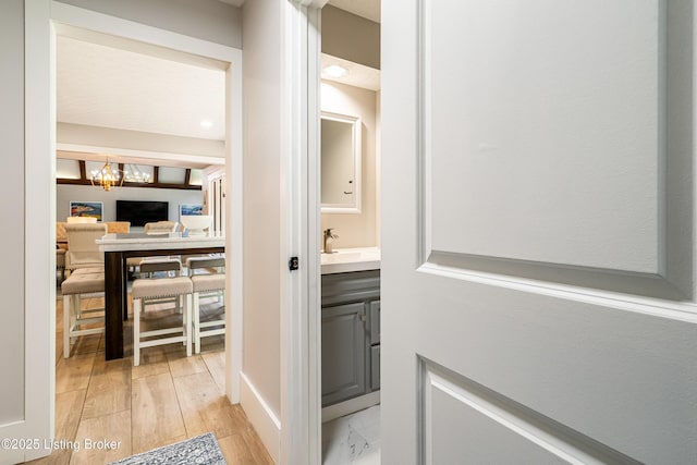 2918 Spickert Knob Rd, Floyds Knobs, IN 47119 - hall with a chandelier and light wood finished floors