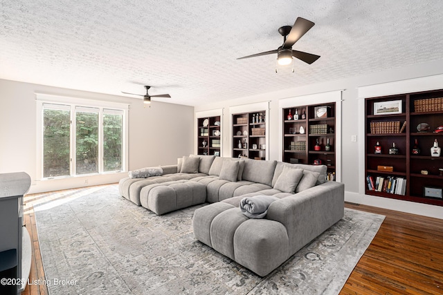 2918 Spickert Knob Rd, Floyds Knobs, IN 47119 - living room featuring ceiling fan, a textured ceiling, built in features, and wood finished floors