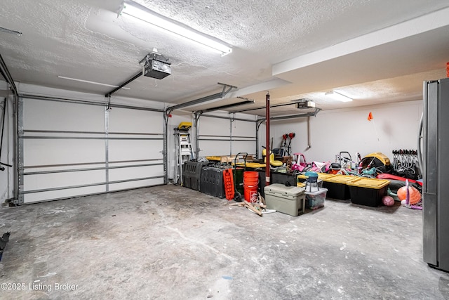 2918 Spickert Knob Rd, Floyds Knobs, IN 47119 - garage featuring a garage door opener and freestanding refrigerator