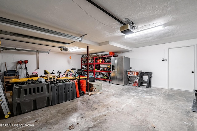 2918 Spickert Knob Rd, Floyds Knobs, IN 47119 - garage featuring stainless steel fridge with ice dispenser, a garage door opener, and a workshop area