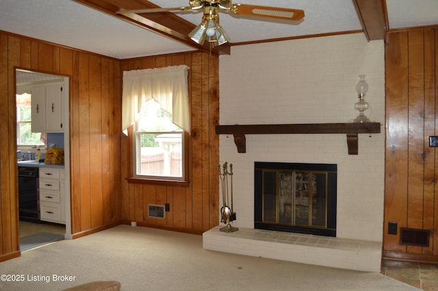 8413 Old Boundary Rd, Louisville, KY 40291 - unfurnished living room featuring ceiling fan, wooden walls, ornamental molding, carpet, and a brick fireplace