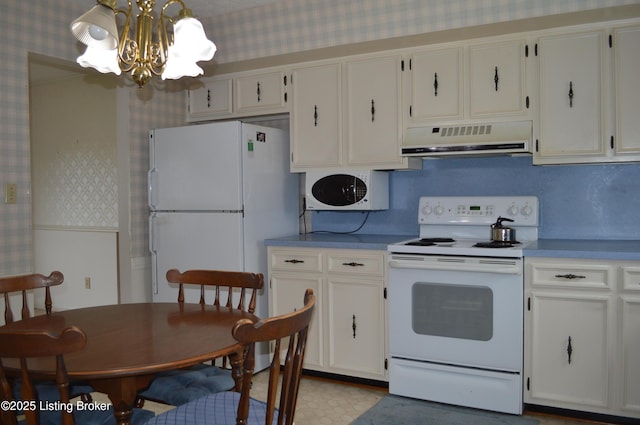 8413 Old Boundary Rd, Louisville, KY 40291 - kitchen with white appliances, exhaust hood, wallpapered walls, a chandelier, and white cabinets