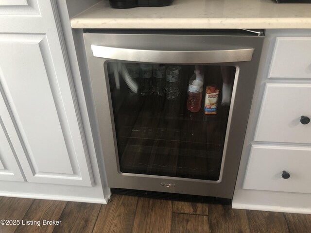 149 Wood Gate Dr, Mt Washington, KY 40047 - kitchen view of wine cooler, wood finished floors, and white cabinets