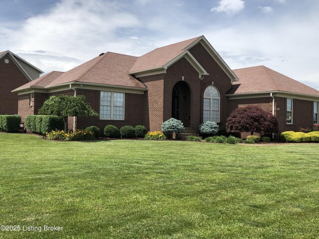 149 Wood Gate Dr, Mt Washington, KY 40047 - view of front facade with brick siding, a front lawn, and roof with shingles