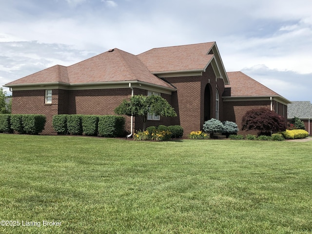 149 Wood Gate Dr, Mt Washington, KY 40047 - view of side of home featuring brick siding, a yard, and roof with shingles